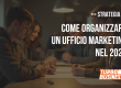 Persone in riunione discutendo strategie per organizzare un ufficio marketing efficace nel 2025.